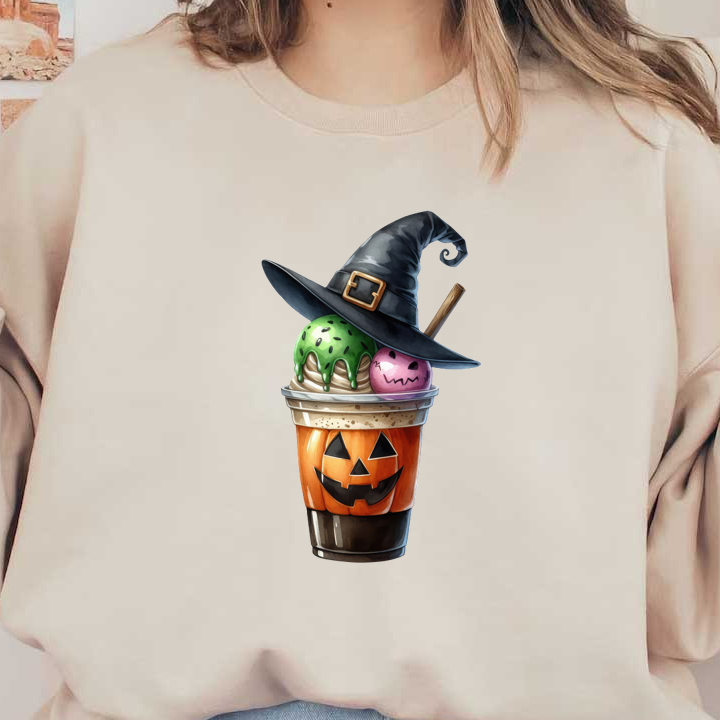 Un divertido vaso de helado con temática de Halloween con bolas verdes y rosas, coronado con un sombrero de bruja y un diseño de calabaza.