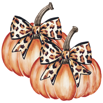 Two charming pumpkins adorned with stylish leopard print bows, perfect for adding a touch of fall flair to any decor.