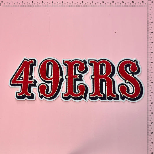 A vibrant, embroidered patch displaying "49ERS" in bold red and black lettering, perfect for sports enthusiasts and collectors.Patches