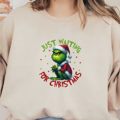 A whimsical illustration of the Grinch in a Santa hat with the text "Just Waiting for Christmas" encircling him. dtf transfers