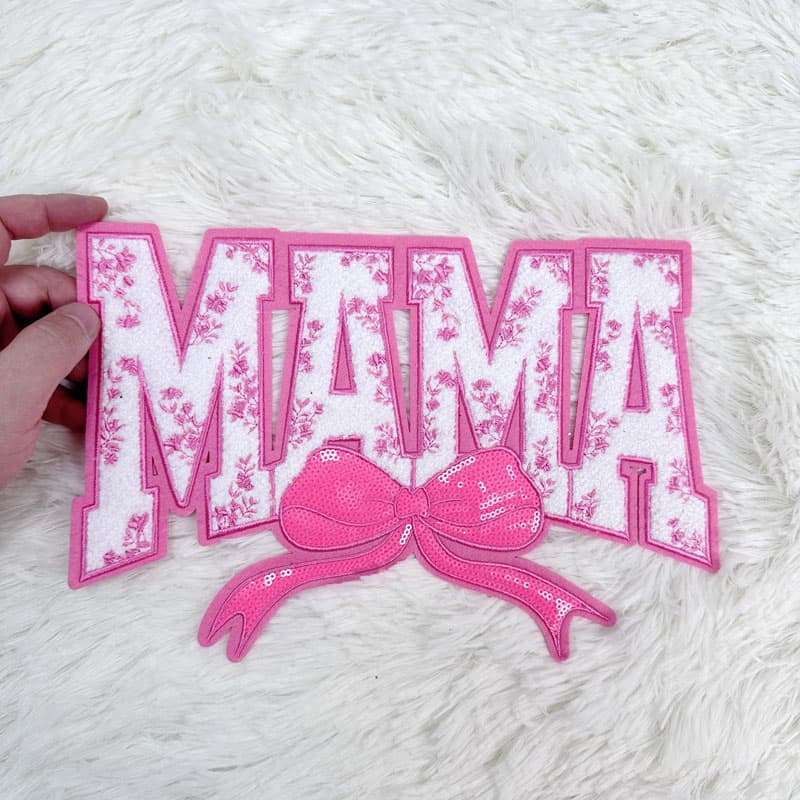 Colorful "MAMA" patches featuring sequined bows, available in pink, red, blue, and light blue, perfect for crafting or embellishing.Patches