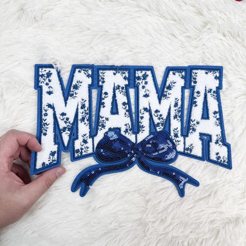 Colorful "MAMA" patches featuring sequined bows, available in pink, red, blue, and light blue, perfect for crafting or embellishing.Patches