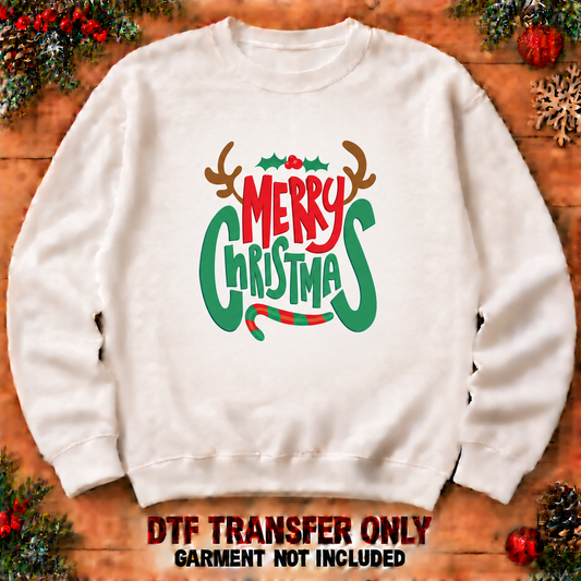 Merry Christmas lettering with antlers DTF transfer XMAS1486-31 shown at12-inch longest side on sweatshirt. Garment not included.