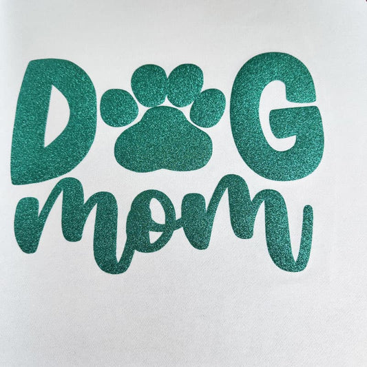 This stylish black shirt features vibrant pink glitter text that proudly proclaims, "Dog Mom," alongside a cute paw print.DTF Transfers puff