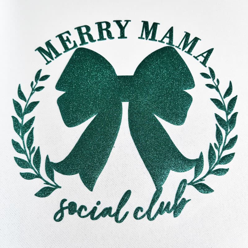 This festive black fabric features a glittery pink bow and the playful text "MERRY MAMA social club," perfect for holiday cheer!DTF Transfers puff