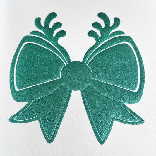 Sparkling green bow with intricate leaf designs, perfect for adding a festive touch to gifts or decorations.DTF Transfers puff