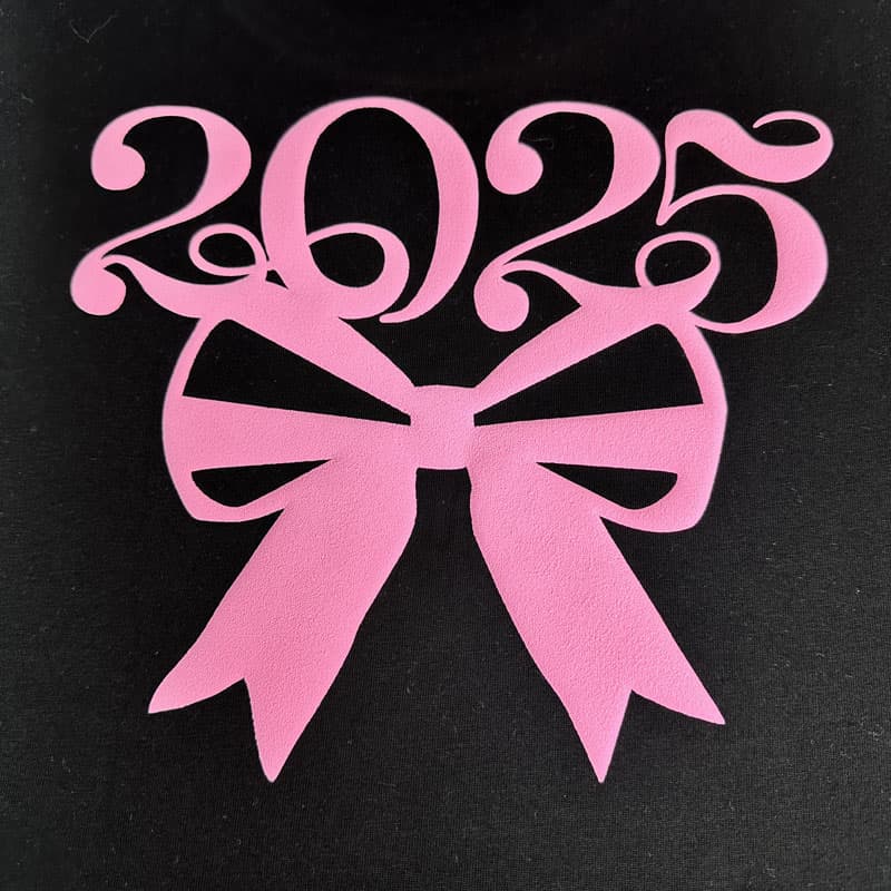 Chic ‘2025’ design with a bold pink bow graphic, perfect for celebratory apparel or custom graduation gifts.DTF Transfers puff