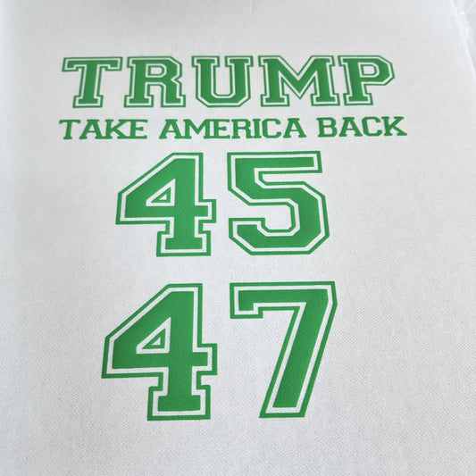 This black shirt features gold glitter lettering that reads "TRUMP TAKE AMERICA BACK" along with the numbers "45" and "47."DTF Transfers puff