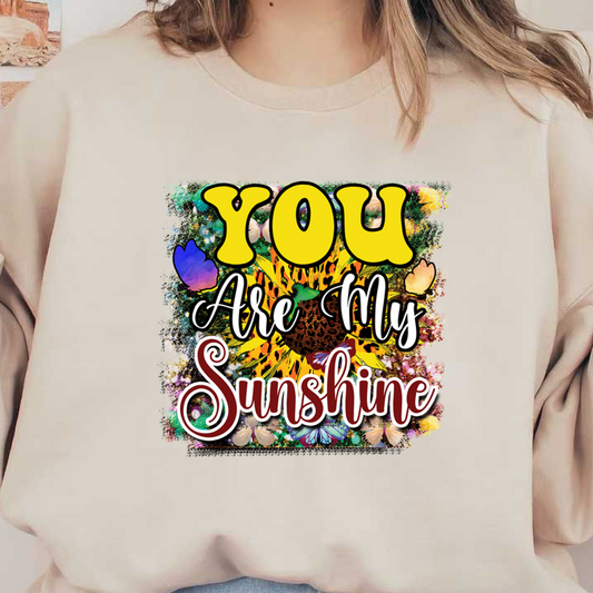 A vibrant design featuring the phrase "You Are My Sunshine" surrounded by colorful butterflies and floral elements. dtf prints