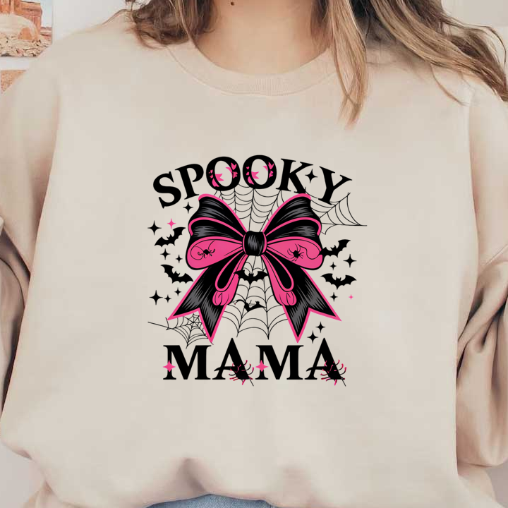 Un gráfico divertido que presenta un lazo rosa y negro con el texto "Spooky Mama", perfecto para prendas o decoración con temática de Halloween.