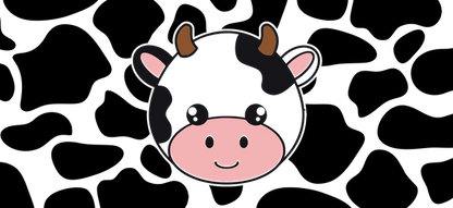 A cute, cartoon-style cow face with black and white patches, small horns, and a cheerful smile.UV Transfers heat press transfers