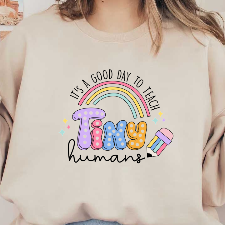 A colorful and playful design featuring the word "Tiny," with a rainbow and a pencil, perfect for creative projects!DTF Transfers