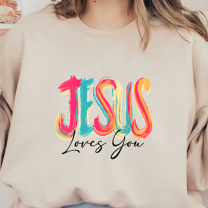 Colorful text design stating, "Jesus Loves You," in vibrant brush strokes.DTF Transfers
