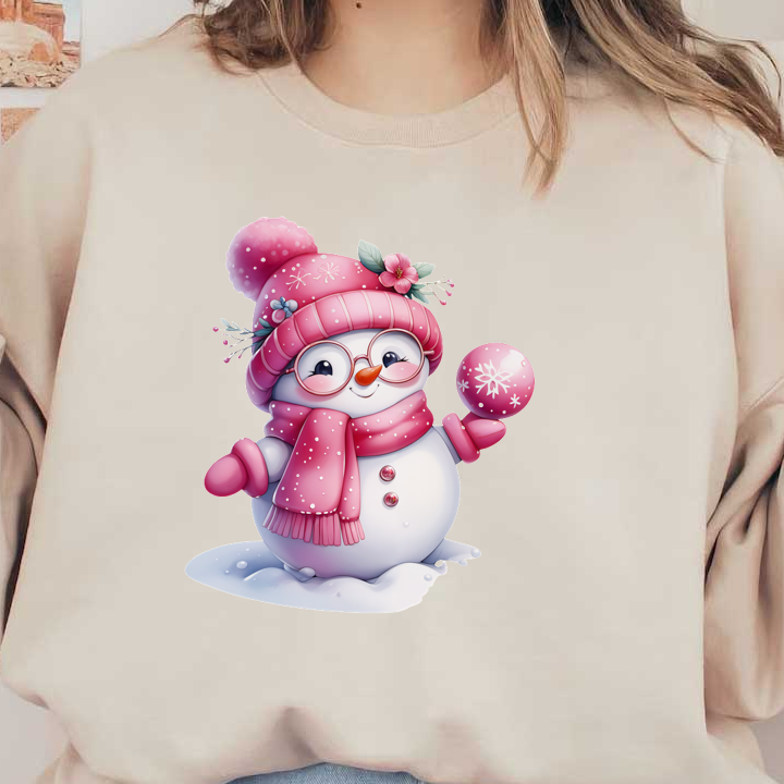 A cheerful snowman dressed in a pink scarf and hat, complete with glasses and holding a snowy pink ornament.dtf regular iron