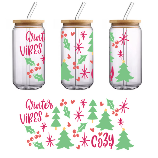 A joyful winter-themed design featuring evergreen trees, holly, and cheerful elements with the text "Winter Vibes Cozy."UV Transfersdtf regular iron