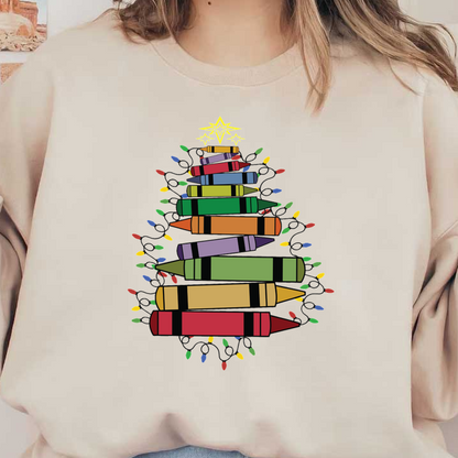 A colorful Christmas tree made of stacked crayons adorned with festive lights and a star on top. heat press transfers