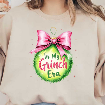 Festive and playful, this vibrant green ornament features the phrase "In My Grinch Era," topped with a pink bow.DTF Transfers