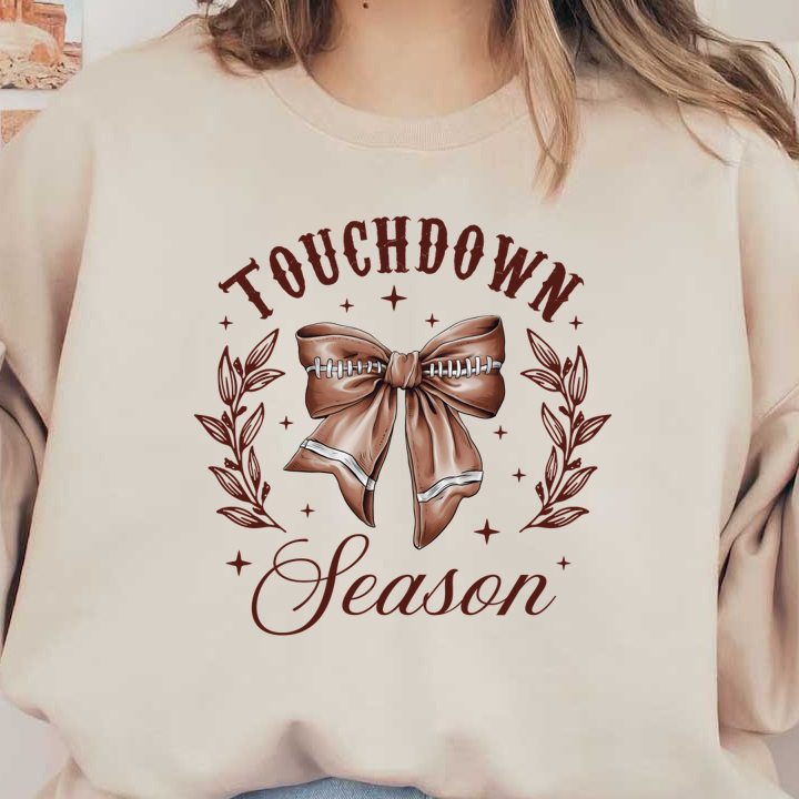 Celebrate football season with this charming design featuring a ribbon styled like a football, accented by "Touchdown Season" text. heat press transfers