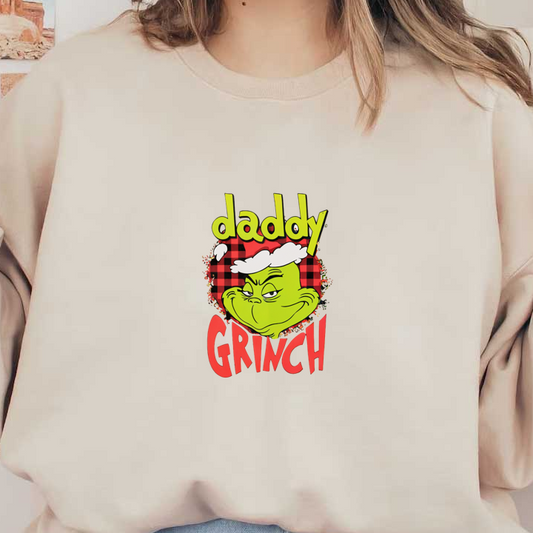 Playful "Daddy Grinch" graphic featuring the Grinch with a mischievous grin set against a red plaid background.DTF Transfers dtf prints