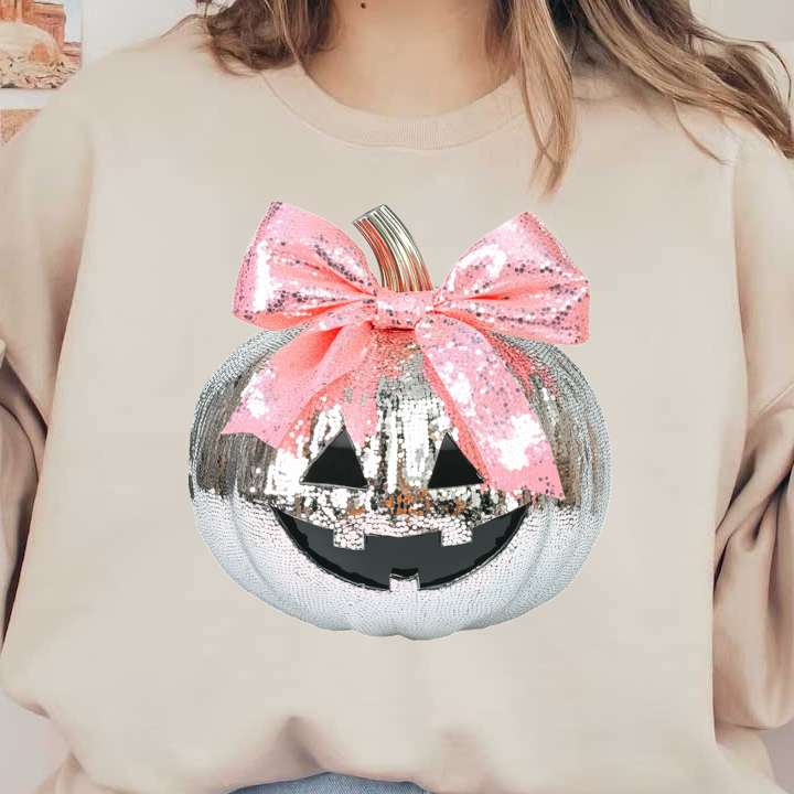 A sparkling silver pumpkin with a cute jack-o'-lantern face and a oversized pink sequin bow, perfect for Halloween decor. dtf transfers