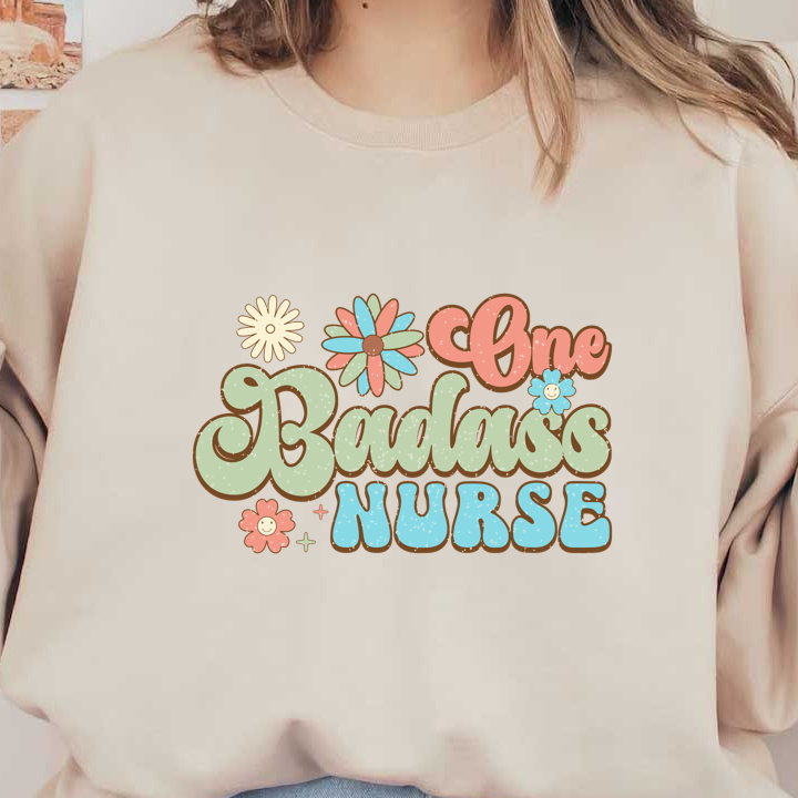 Celebrate healthcare heroes with this colorful design featuring the words "One Badass Nurse" adorned with cheerful flowers!DTF Transfers