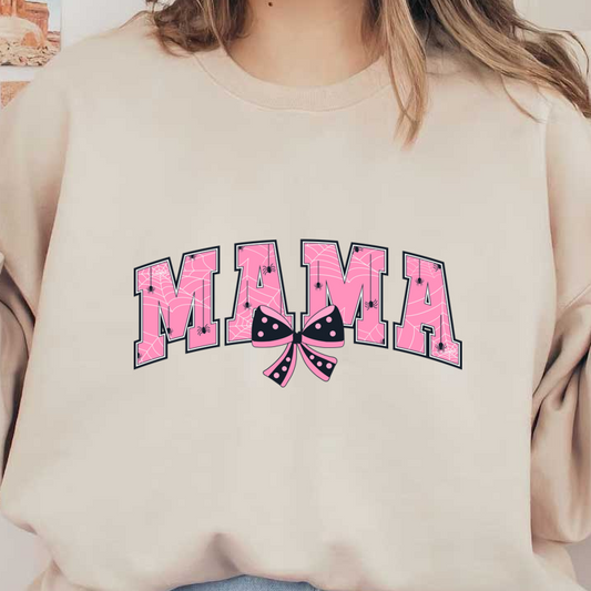 A playful pink graphic featuring the word "MAMA" adorned with spider webs and a polka dot ribbon bow. dtf transfers