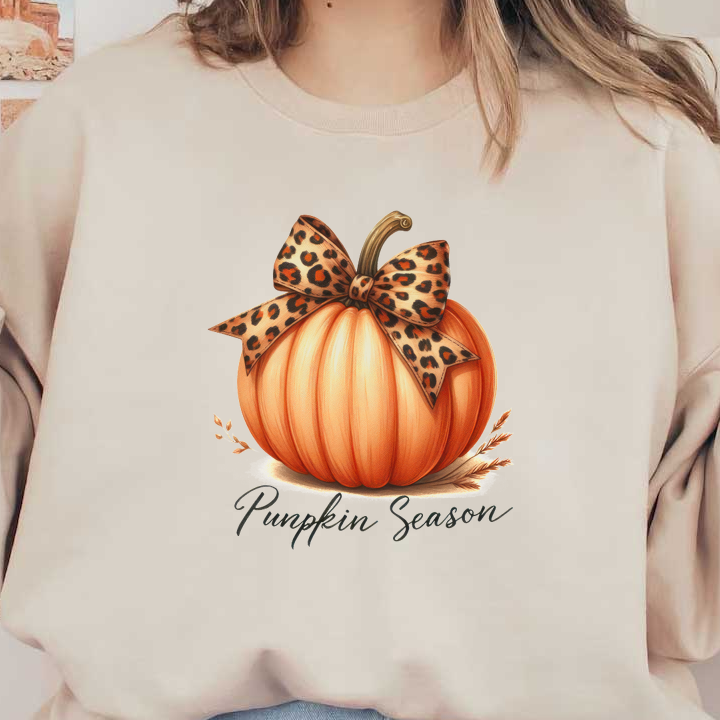 A festive pumpkin adorned with a stylish leopard print bow, celebrating the cozy vibes of pumpkin season.dtf regular iron