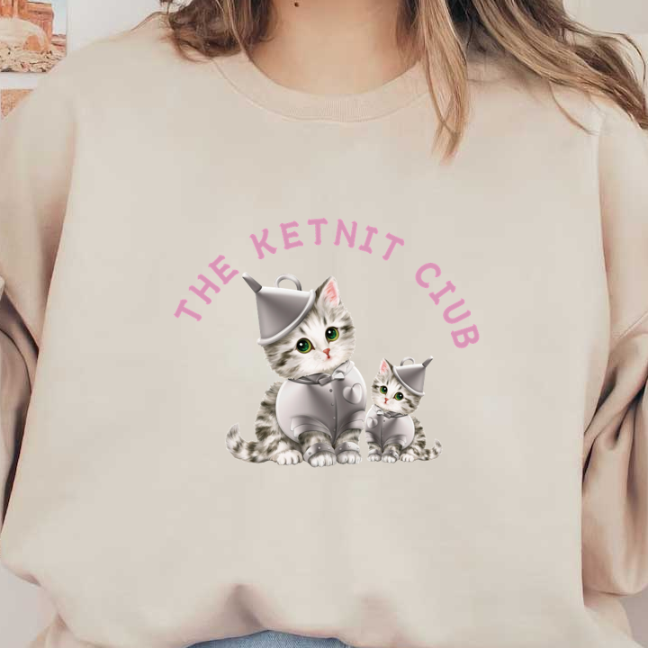 Adorables gatitos de dibujos animados vestidos con trajes de hombre de hojalata plateados, con una fuente caprichosa que dice "The Ketnit Club".