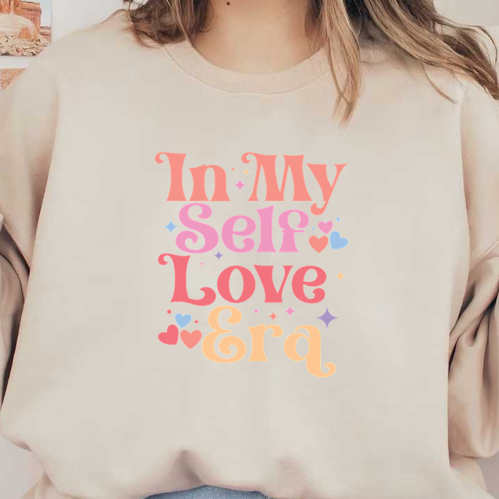 Un diseño vibrante y divertido que presenta la frase "In My Self Love Era" adornada con corazones y estrellas de colores.