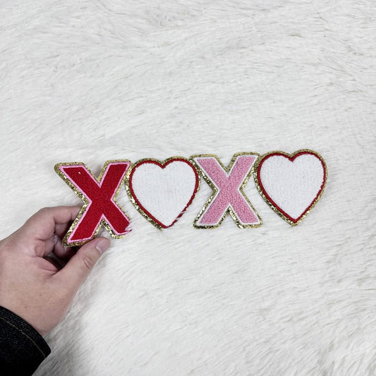 Colorful "XOXO" patches with red and pink hearts, featuring a sparkly gold trim, perfect for adding a festive touch!Patches