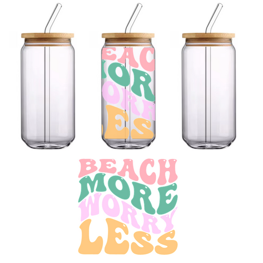 A vibrant, fun graphic featuring the playful phrase "Beach More Worry Less" in colorful, bold lettering.UV Transfersdtf regular iron