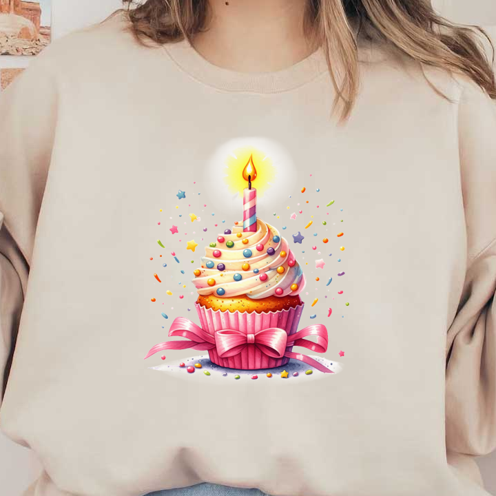 A vibrant birthday cupcake topped with creamy frosting, colorful sprinkles, and a lit candle, adorned with a pink bow.DTF Transfers