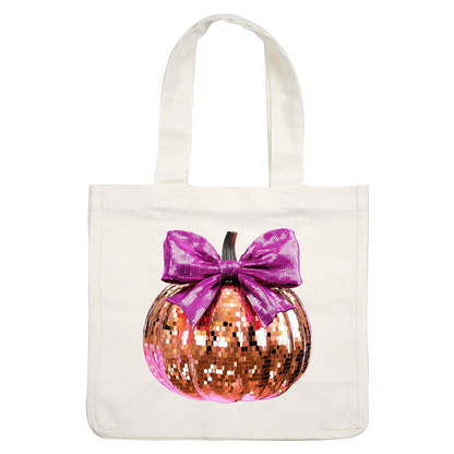 A glamorous, sequined pumpkin in rose gold, adorned with a vibrant pink bow, perfect for festive decor.dtf regular iron