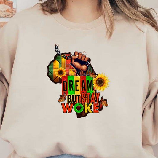 A vibrant graphic design featuring a raised fist, sunflowers, and the text "DREAM BUT STAY WOKE" against a colorful African map backdrop.dtf regular iron