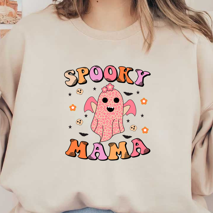 A playful and colorful design featuring a cute ghost with leopard spots and the text "Spooky Mama" surrounded by stars and skulls. dtf prints