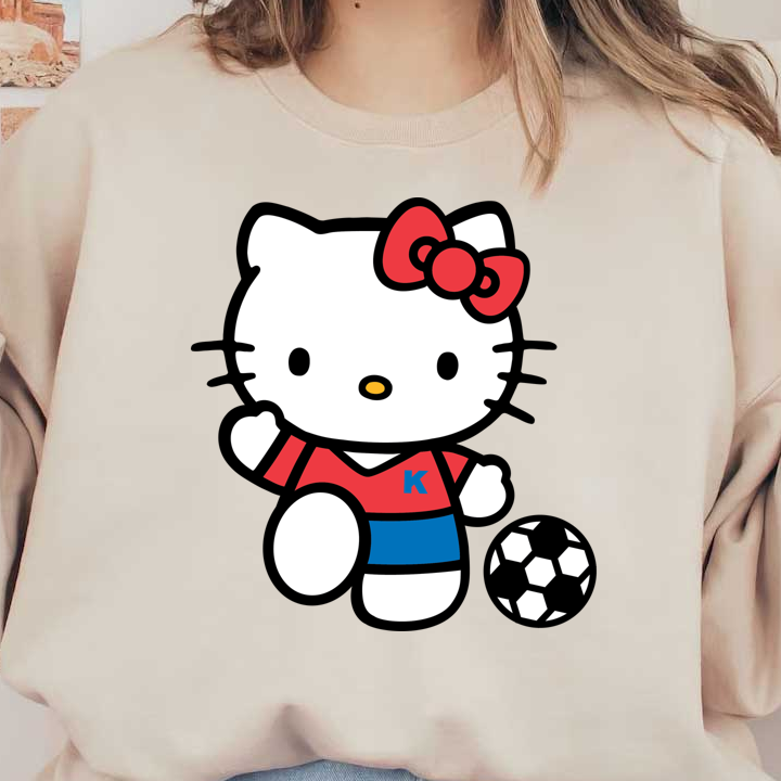 Hello Kitty is dressed in a red and blue soccer uniform, playfully posing with a black and white soccer ball.DTF Transfers