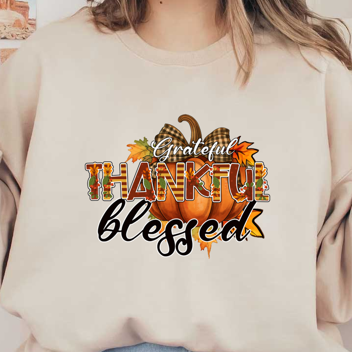 A festive design featuring the words "Grateful," "Thankful," and "Blessed" with a pumpkin and autumn leaves, perfect for fall!dtf regular iron