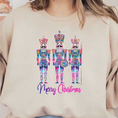 Three colorful, festive nutcracker figurines adorned with jewels and crowns, celebrating the holiday spirit with a "Merry Christmas" message.DTF Transfers