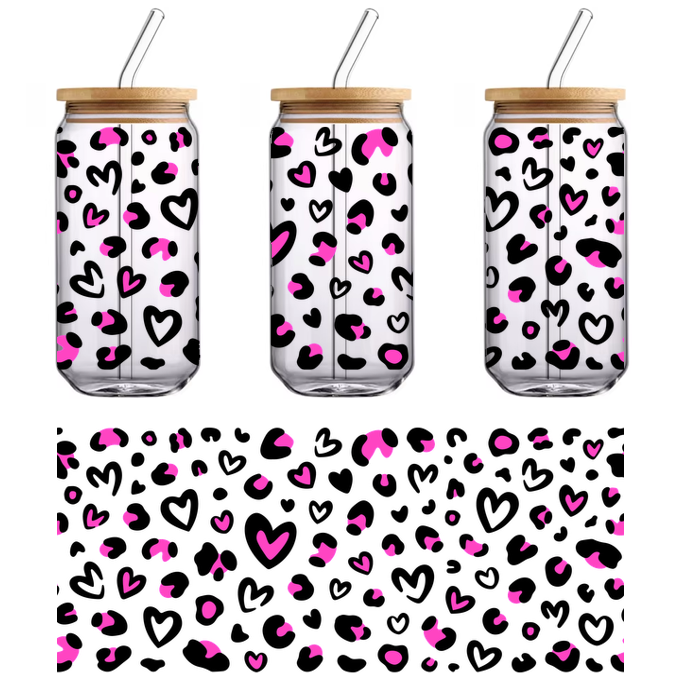 A vibrant pattern of pink hearts and shapes scattered against a black background.UV Transfers