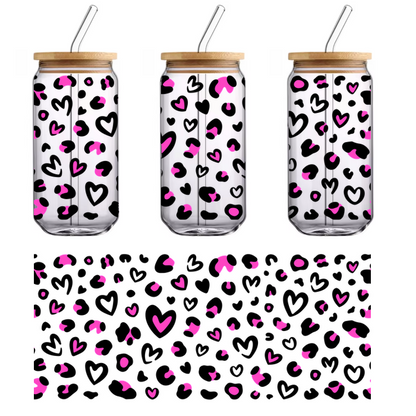 A vibrant pattern of pink hearts and shapes scattered against a black background.UV Transfers