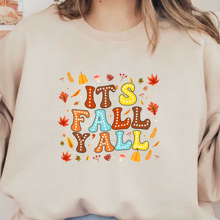 A festive autumn-themed design featuring colorful, playful text that reads "It's Fall Y'all" surrounded by leaves and seasonal icons. dtf prints