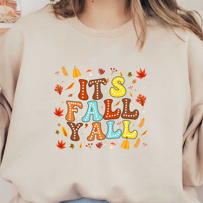 A festive autumn-themed design featuring colorful, playful text that reads "It's Fall Y'all" surrounded by leaves and seasonal icons. dtf prints