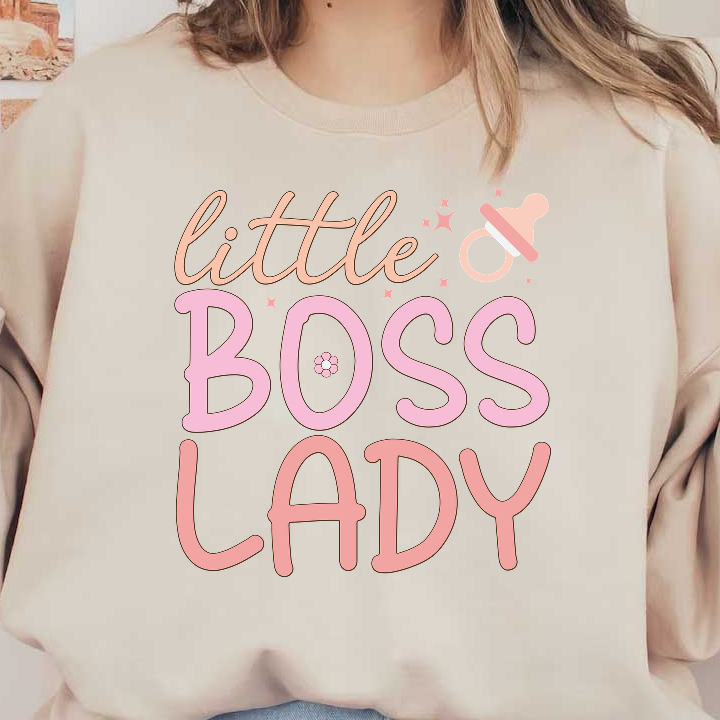 A playful design featuring the phrase "little BOSS LADY" in soft pink colors, ideal for celebrating a little one's strong personality!DTF Transfers