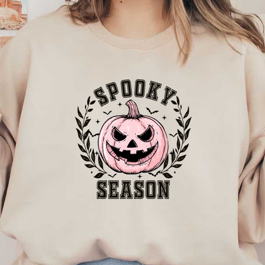 A playful illustration of a sinister pink pumpkin surrounded by leaves, celebrating the fun of spooky season. heat press transfers