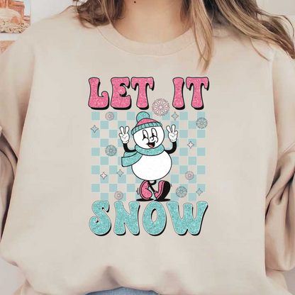 A cheerful snowman in a hat and scarf playfully poses with "Let It Snow" in sparkling lettering and playful snowflakes.dtf regular iron