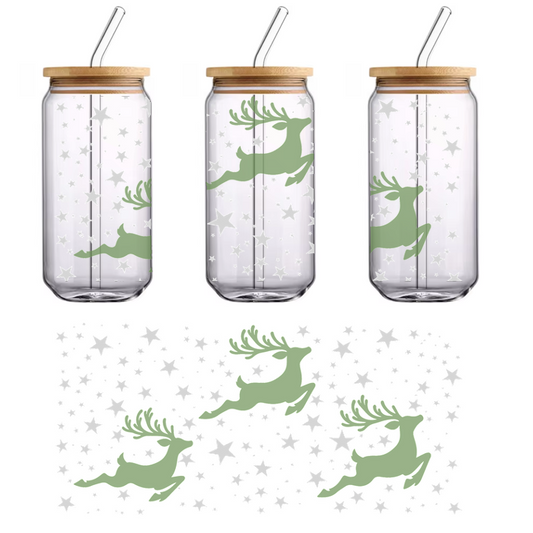 A whimsical illustration featuring three green reindeer prancing among scattered silver stars, perfect for festive decorations.UV Transfers dtf transfers