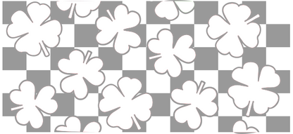 A playful pattern of white four-leaf clovers scattered over a black background, symbolizing luck and positivity.UV Transfers dtf transfers